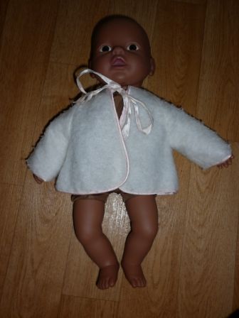 wit jasje met roze biesjes 30-32 cm