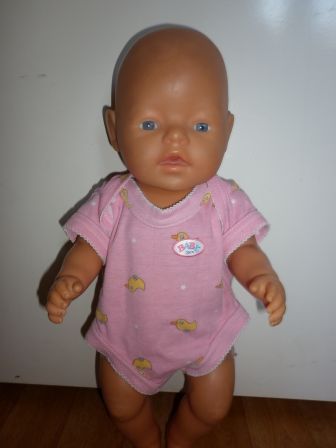 roze romper met eendjes 43 cm