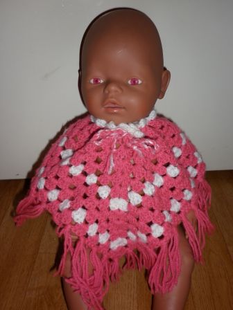 donkerroze/witte poncho 43-48 cm