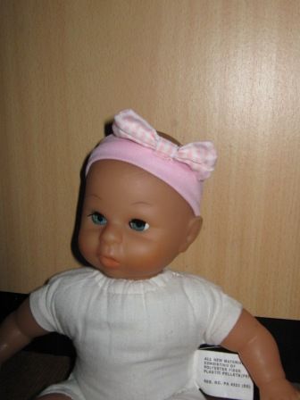 roze hoofdbandje met strik 27 cm