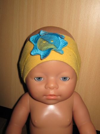 gele hoofdband met blauwe zon