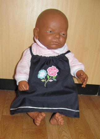 donkerblauw jurkje met roze/streep shirt en hoofdbandje 48-50 cm