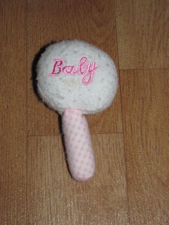 stoffen rammelaar in roze/wit