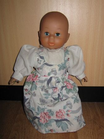 jurkje met witte mouwtjes en bloemen 27 cm